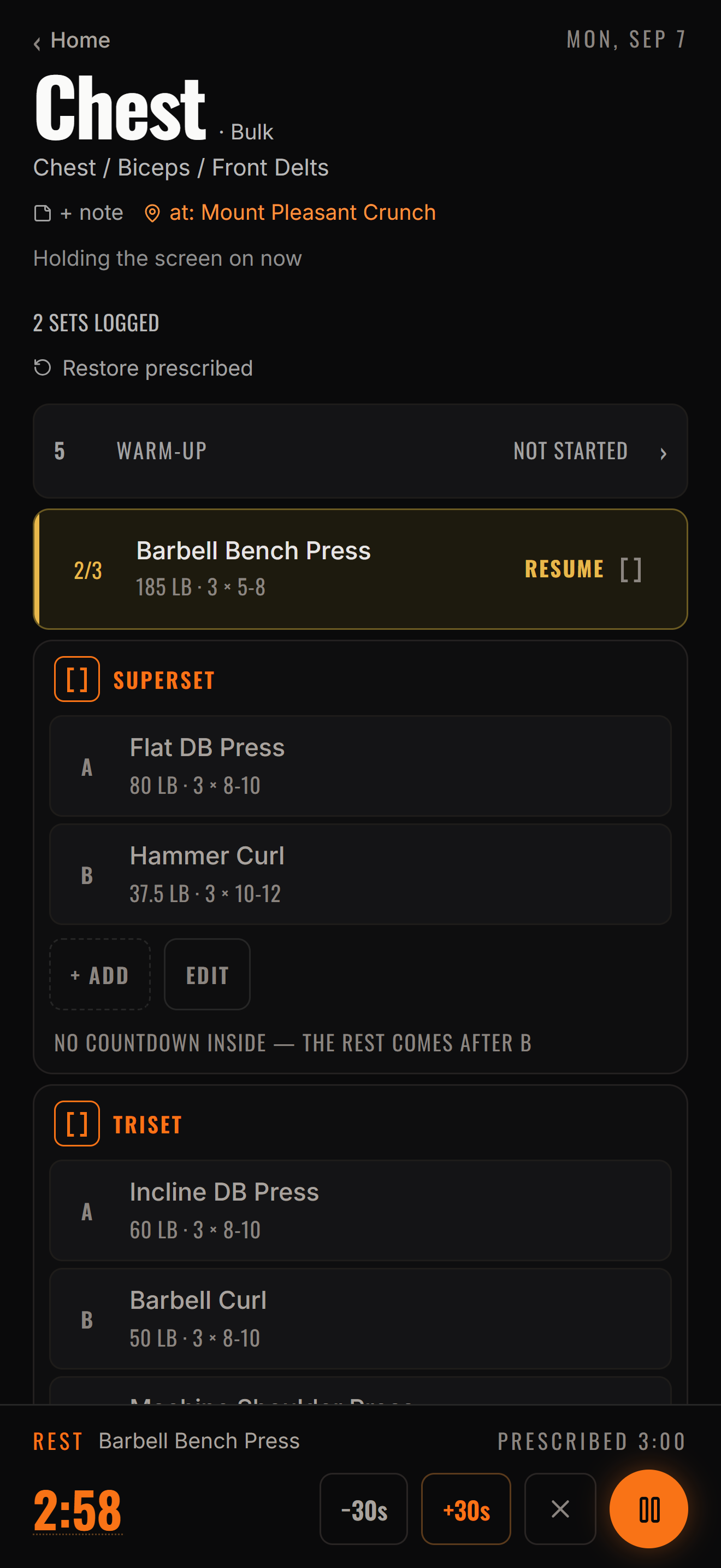Logging a set in Sadan: a Chest session with sets logged, a superset, and a rest timer running.